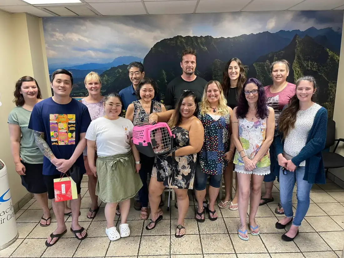 A group of volunteers smiling together